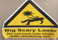 Laser varoitus